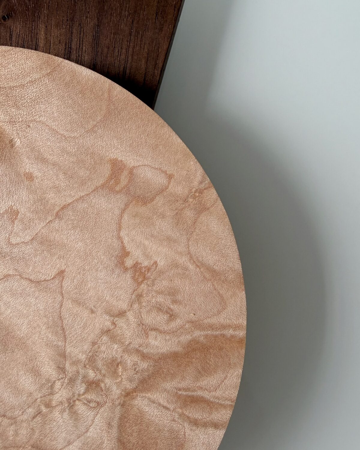 A large maple dish, its figured grain left smooth
