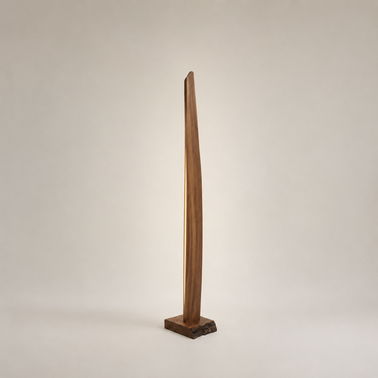 A tall walnut floor lamp with a glowing light seam and a live-edge base